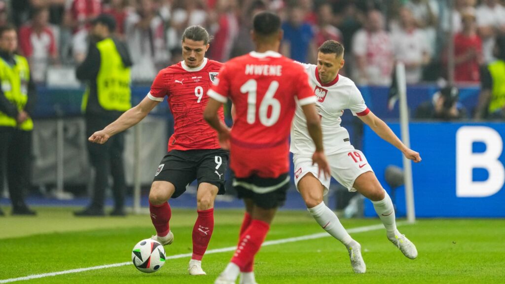 Marcel Sabitzer et Przemyslaw Frankowski lors de Pologne Autriche a l Euro 21 juin 2024 1889061